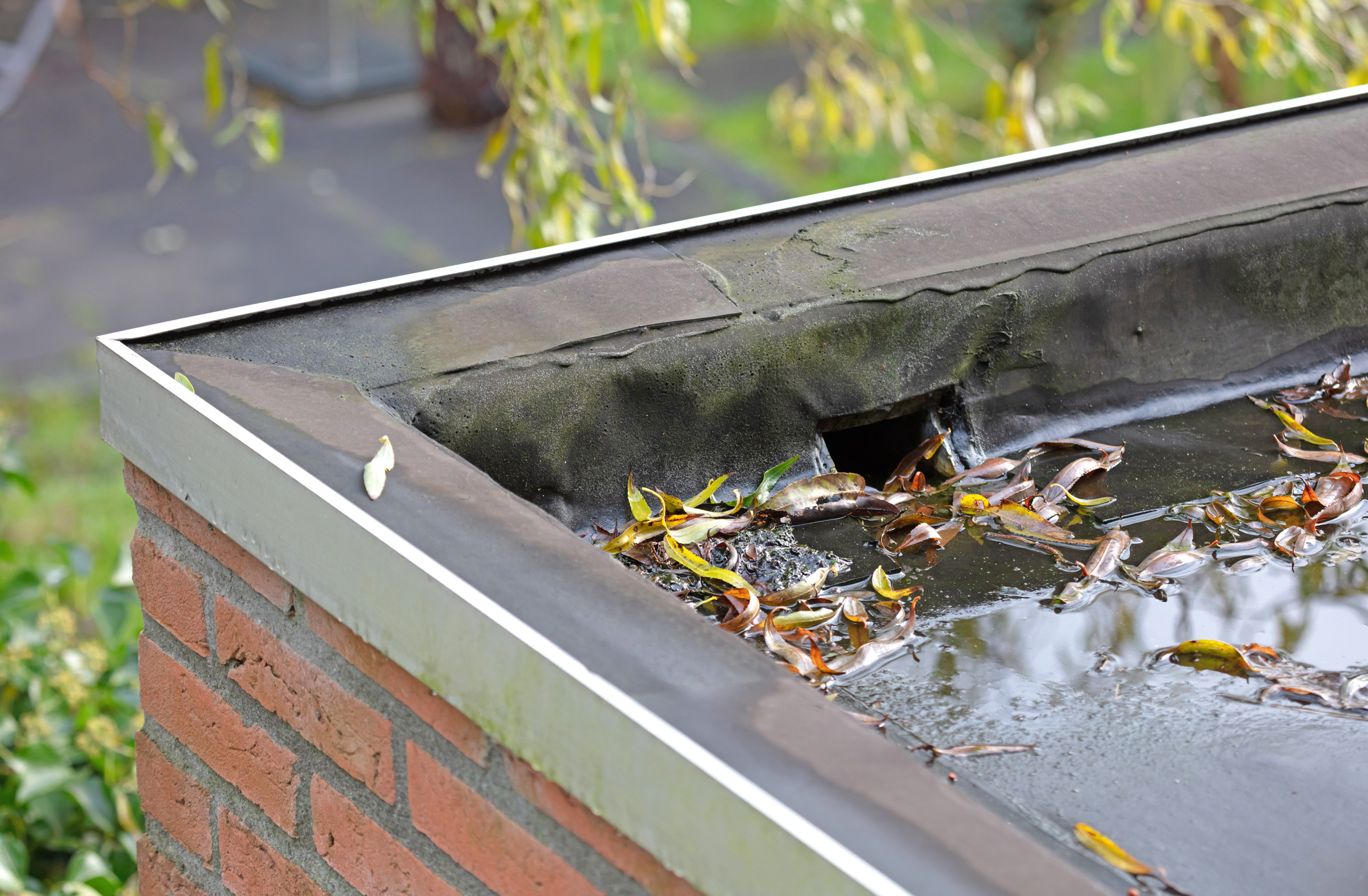 Water drainage on a flat roof, selective focus